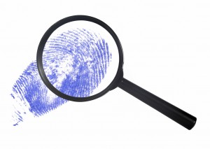 magnifying glass over a blue digital print